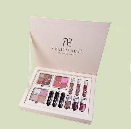 REALBEAUTY makeup gift set with eyeshadow, blush, lipsticks, and gloss in an open box